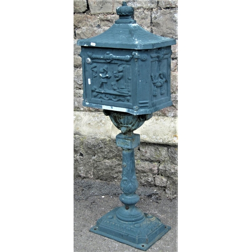 2146 - A reclaimed freestanding cast alloy post box, the simulated tiled roof with crown shaped finial over... 