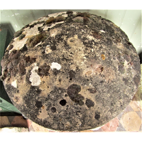 2172 - A weathered natural stone staddlestone of typical square tapered form beneath a domed cap, approx 80... 