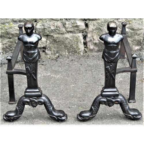 2178 - A pair of heavy cast iron andirons in the form of classical male half torsos, raised on entwined sty... 