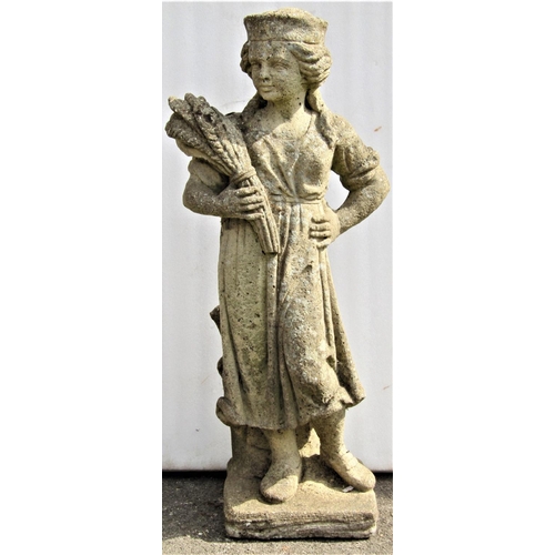 2181 - A reclaimed garden ornament in the form of a standing female harvesting figure, 76cm high