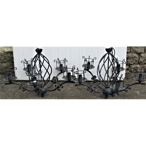 2197 - A pair of contemporary cast metal five branch electroliers, with open spiral twist stems and bound C... 