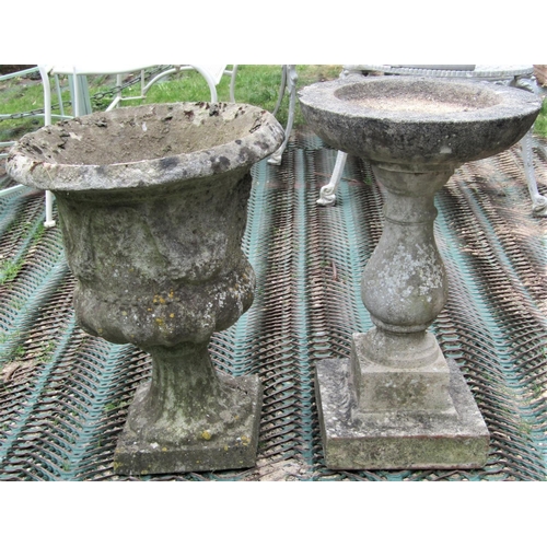 2208 - A reclaimed garden planter in the form of a Grecian urn, with Greek key border and trailing and frui... 