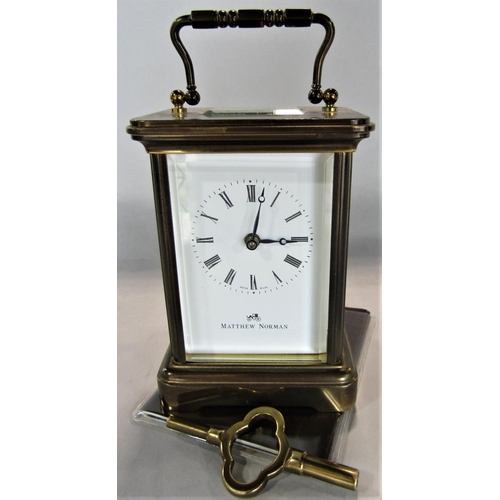 1537 - Matthew Norman of London brass cased carriage clock, 12cm high, key and papers