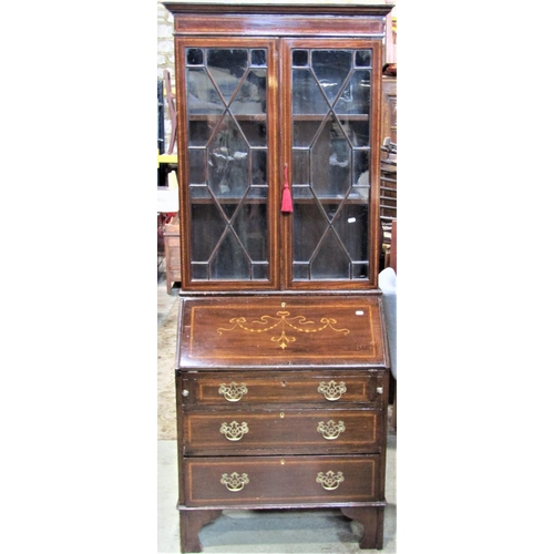 2314 - An inlaid Edwardian mahogany bureau bookcase, the upper section enclosed by a pair of astragal glaze... 