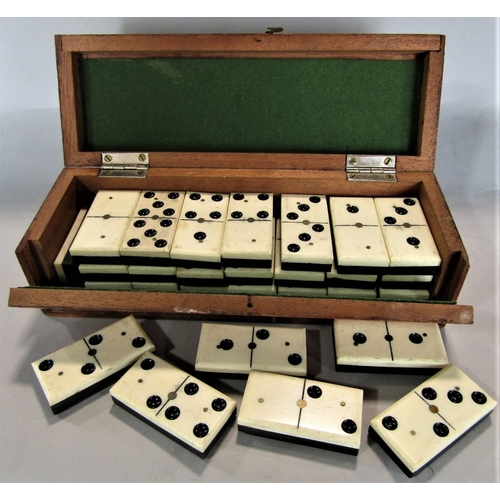 1541 - Vintage mahogany cased set of bone and horn dominos with brass inset detail, the box with hinged lid... 