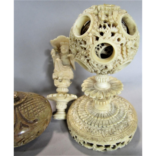 1545 - 19th century canton ivory concentric ball on stand, 10cm high, together with a further ivory figural... 