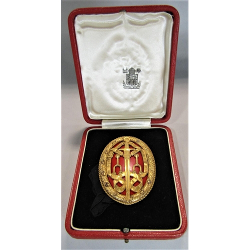 1557 - Royal Mint silver gilt night bachelor award medal, with gilt pierced sword and ribbon decoration wit... 