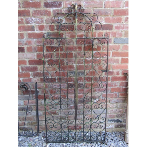 2094 - An ironwork pedestrian gate with decorative scrollwork detail 87 cm wide (including hinge) 181 cm hi... 