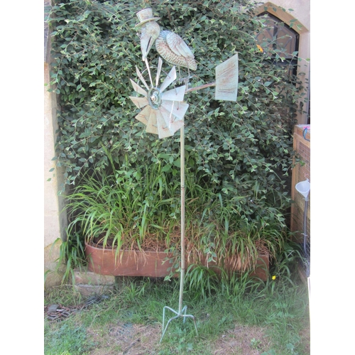 2106 - A contemporary light steel novelty garden wind generator, the finial in the form of a bird wearing a... 