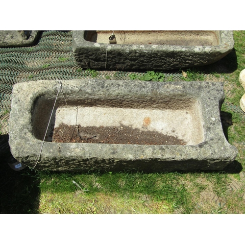 2132 - A weathered granite trough of rectangular form with single shaped end, 118cm long x 45cm wide x 34cm... 