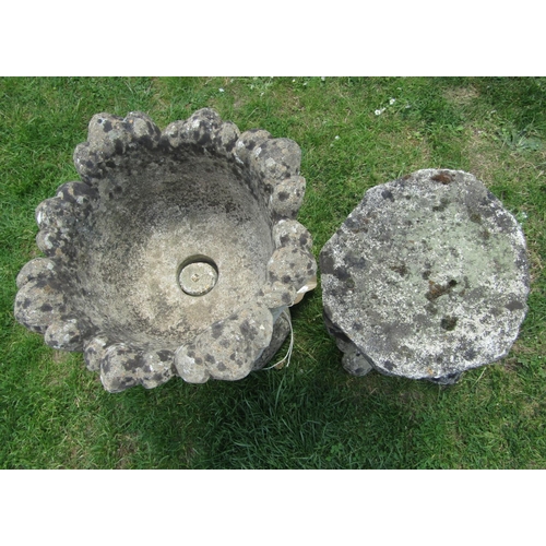 2135 - A reclaimed garden urn with acanthus leaf bowl and foliate socle with foliate octagonal base, togeth... 