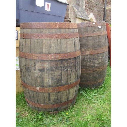 2142 - A paid of coopered oak and steel banded bourbon whiskey approx 60cm diameter x 90cm high