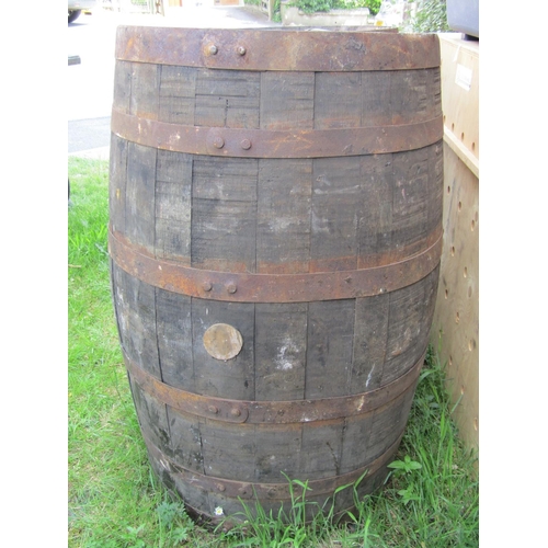 2142 - A paid of coopered oak and steel banded bourbon whiskey approx 60cm diameter x 90cm high