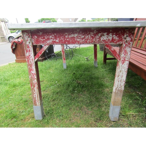 2145 - A work or garden table of rectangular form with zinc clad top raised on painted and distressed pine ... 