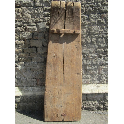 2232 - A vintage pine agricultural curved threshing board/sculpture, with inset flint stone, 55cm wide x 18... 