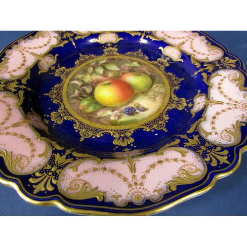 1062 - A pair of Royal Worcester cabinet plates with central fruit panels signed R Sebright within pink and... 