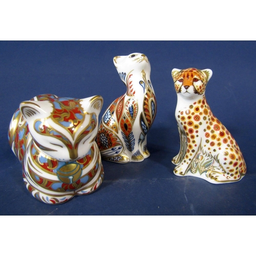 1077 - A collection of three Royal Crown Derby imari pattern paperweights in the form of a cheetah cub, a r... 