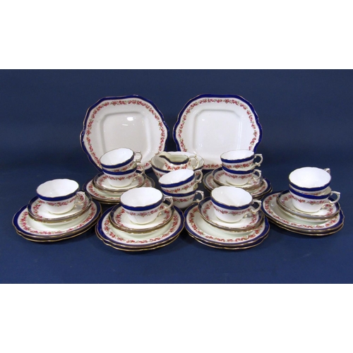 1082 - A collection of Hammersley China teawares with rose border decoration comprising a pair of cake plat... 