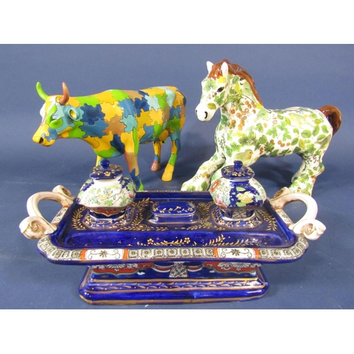 1083 - An unusual model of a cow with jigsaw puzzle style detail, a further model of a trotting horse with ... 