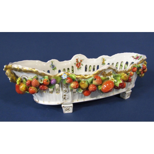 1090 - A late 19th century continental bowl of elongated oval form with applied fruit swag, painted floral ... 