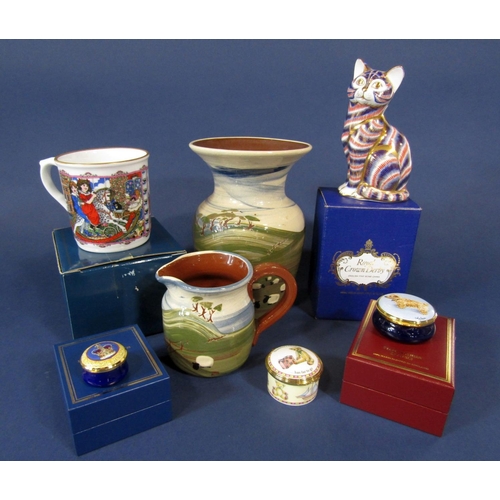 1091 - A boxed Royal Crown Derby paperweight in the form of a seated cat, together with a Halcyon Days boxe... 