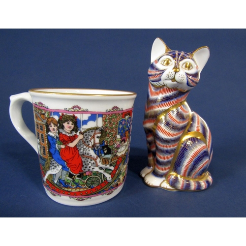 1091 - A boxed Royal Crown Derby paperweight in the form of a seated cat, together with a Halcyon Days boxe... 