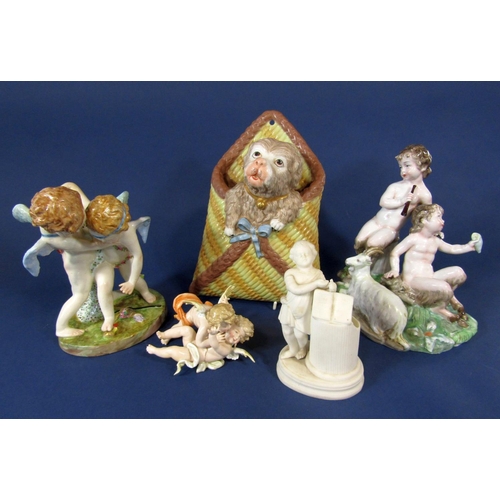 1094 - A collection of decorative ceramics including a late 19th century continental group of two playful c... 