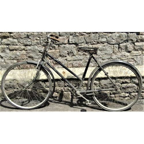 2230 - A ladies bicycle with swept back handle bars, with pierced Philips cog, (af)