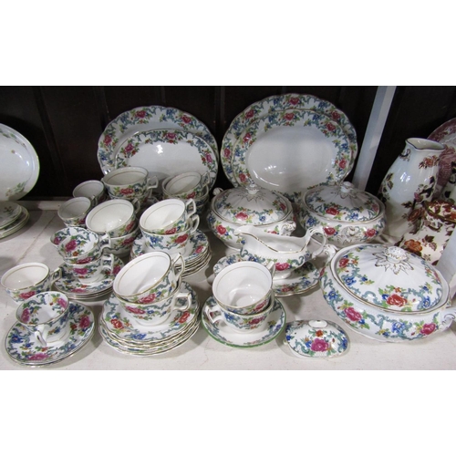 1129 - A collection of Booths floradora patternwares comprising three tureens and covers, four oval serving... 