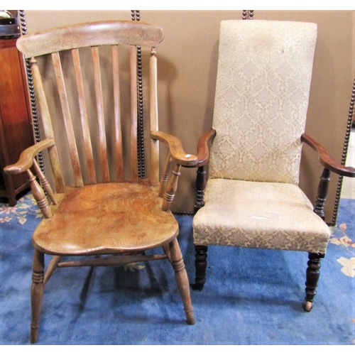 2284 - A Windsor elm and beechwood lathe back arm chair with wide generous saddle shaped seat raised on spl... 