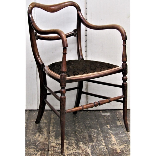 2779 - A Regency beechwood elbow chair with simulated rosewood graining, on swept supports