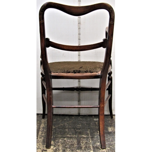 2779 - A Regency beechwood elbow chair with simulated rosewood graining, on swept supports