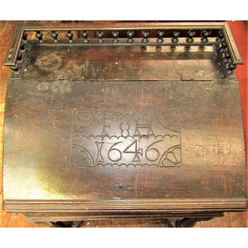 2792 - An Old English oak writing desk, the sloping lid monogrammed and dated 1646, set beneath a turned sp... 