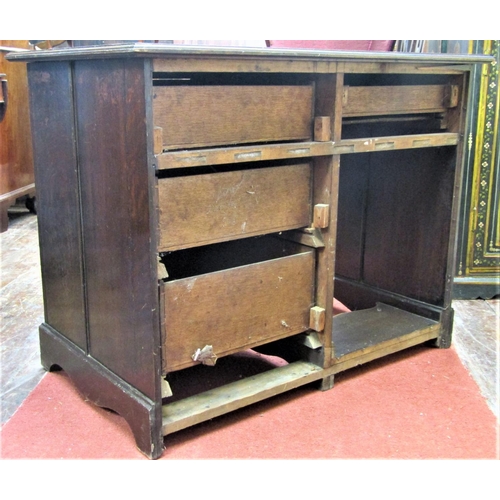 2793 - A late 19th century oak single pedestal writing desk fitted with four drawers with carved outline, w... 