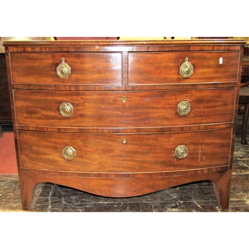 2798 - A Georgian mahogany bowfronted chest of two long and two short drawers, with brass plate handles on ... 