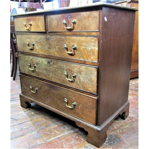 2800 - A good Georgian mahogany chest of three long and two short drawers, the top crossbanded and raised o... 