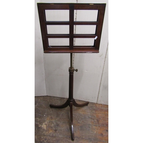 2802 - A Regency style mahogany sheet music stand with adjustable frame, the fluted column set on a swept t... 