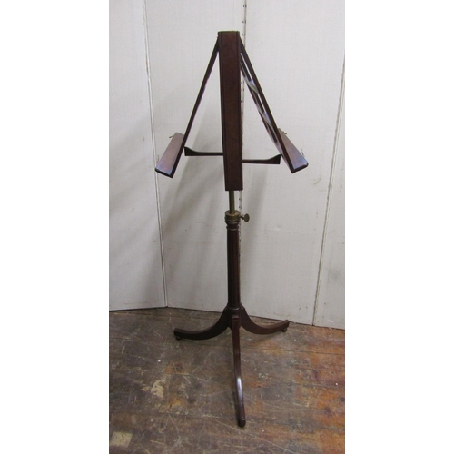 2802 - A Regency style mahogany sheet music stand with adjustable frame, the fluted column set on a swept t... 