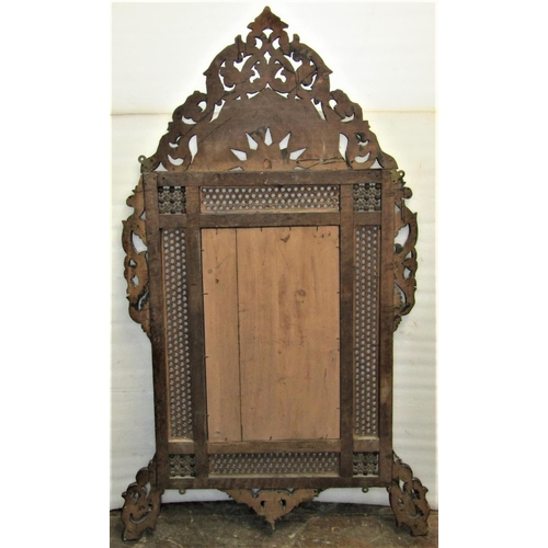 2822 - A late 19th century Moorish wall mirror with honeycomb pierced detail and repeating foliate decorati... 