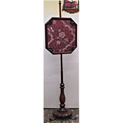 2826 - A Regency mahogany face screen, the column supporting a rectangular framework with carved detail