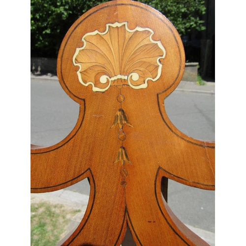 2828 - A satinwood easel of full height with inlaid detail and further carved panels