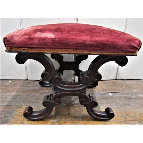 2834 - A late Regency period mahogany centre stool with square cut upholstered top raised on a mahogany fra... 