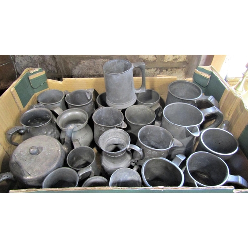 705 - A box containing a large collection of pewter tankards