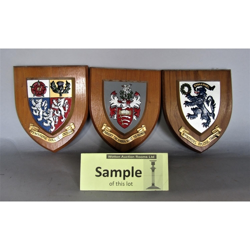 718 - A collection of wall shields, each decorated with a polychrome crest for Royal Army Ordinance Corps,... 