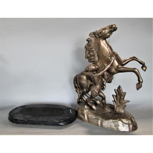 725 - a pair of cast spelter figures of Marley horses, upon oval ebonised plinth bases, 44cm high (2)