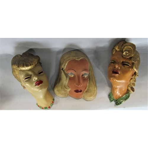 726 - A collection of wall plaques to include to 3 plaster pin-ups in the manner of Goldscheider, futher p... 