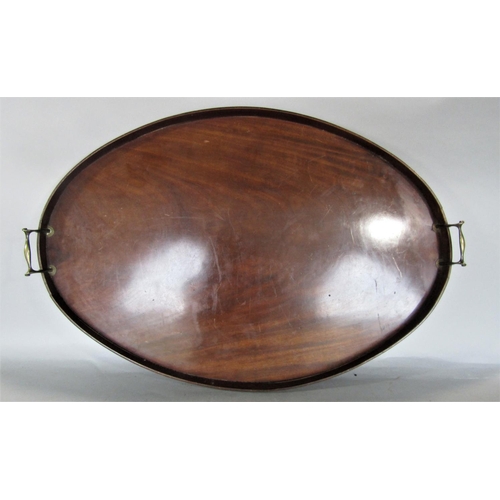 731 - A large flame mahogany oval twin handled gallery tray, 77 x 53cm