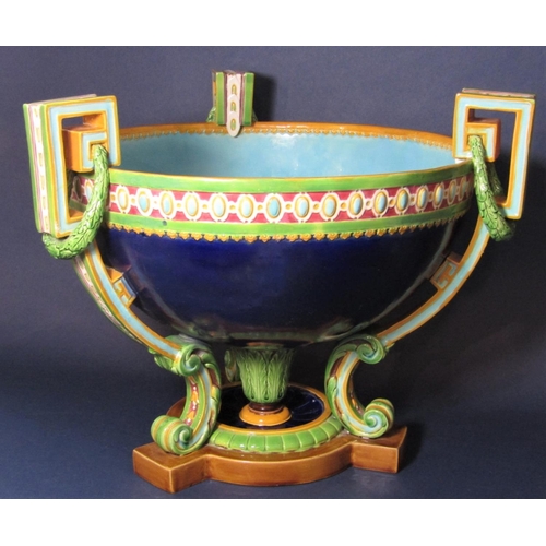 1110 - A large 19th century Minton majolica three handled table centre with moulded and painted border deta... 