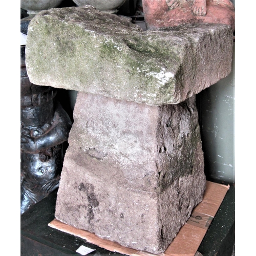 2176 - A small/squat weathered natural stone staddlestone, of square tapered form with square cap, 44cm hig... 