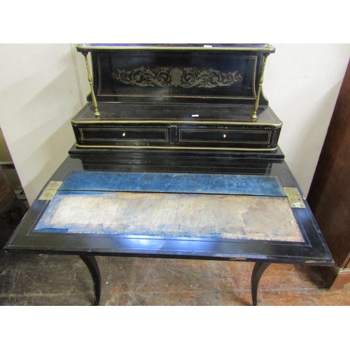 2806 - A 19th century French bonheur de jour, the ebonised finish with inlaid engraved brass detail, foldin... 